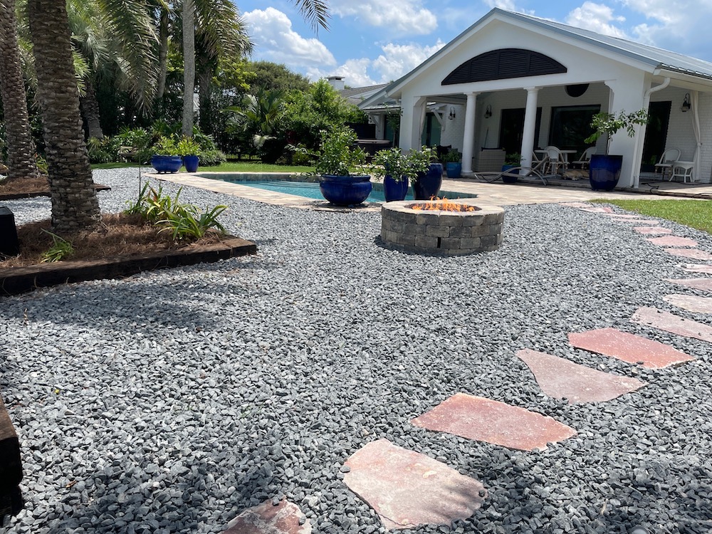 potted plants surrounding a pool patio 