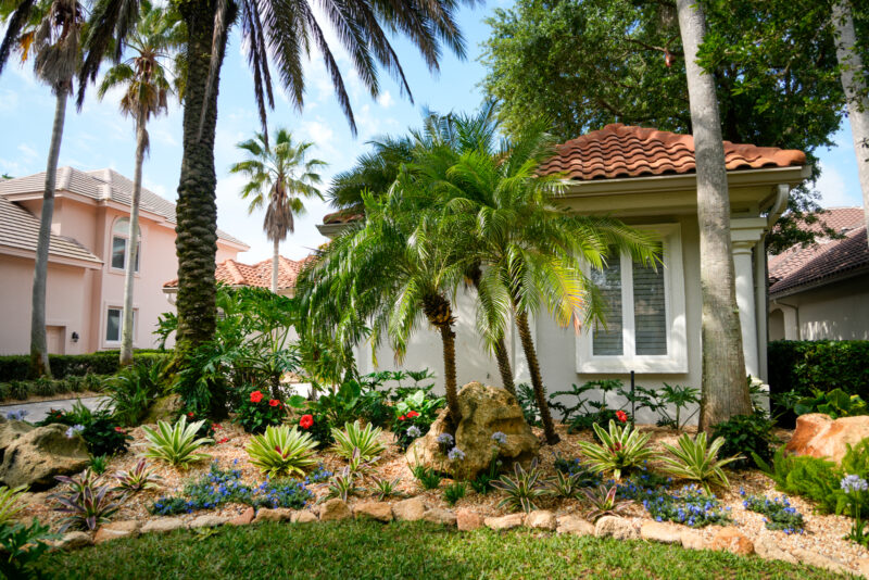 Elegant Florida front yard hardscaping featuring walkways and patios, as part of a modern landscaping project in Florida that faces climate and weather challenges