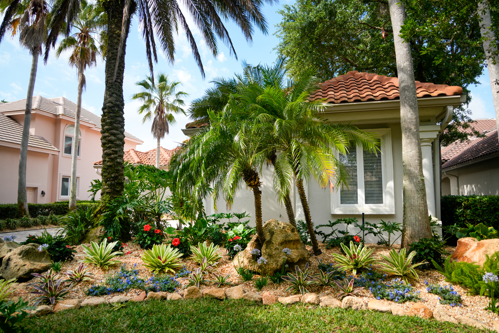 Large, natural boulders strategically placed in the landscape, adding a sense of grandeur and anchoring the garden design