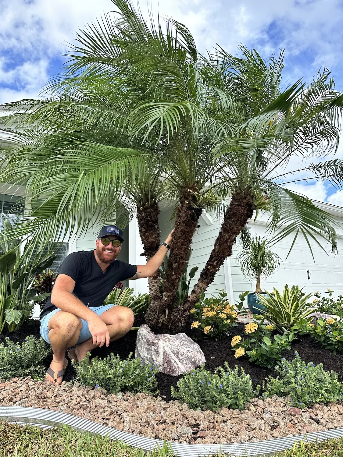Mixed-use landscape design featuring organic and inorganic mulches with lush foliage and stone hardscaping to extend garden life.