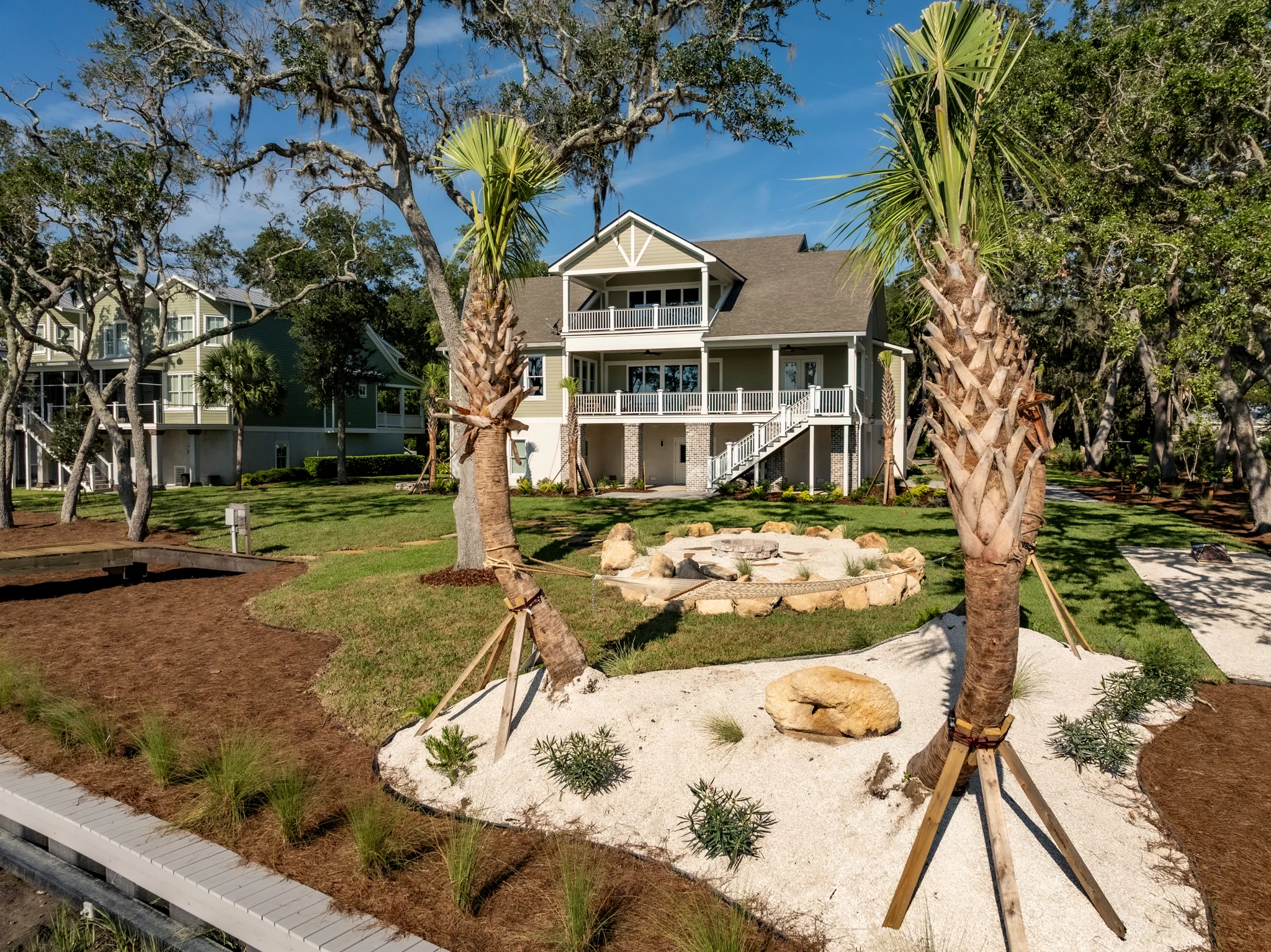 Zoysia Lawn Installation Zoysia grass installation in St. Mary’s Georgia with palms and coastal-friendly landscaping