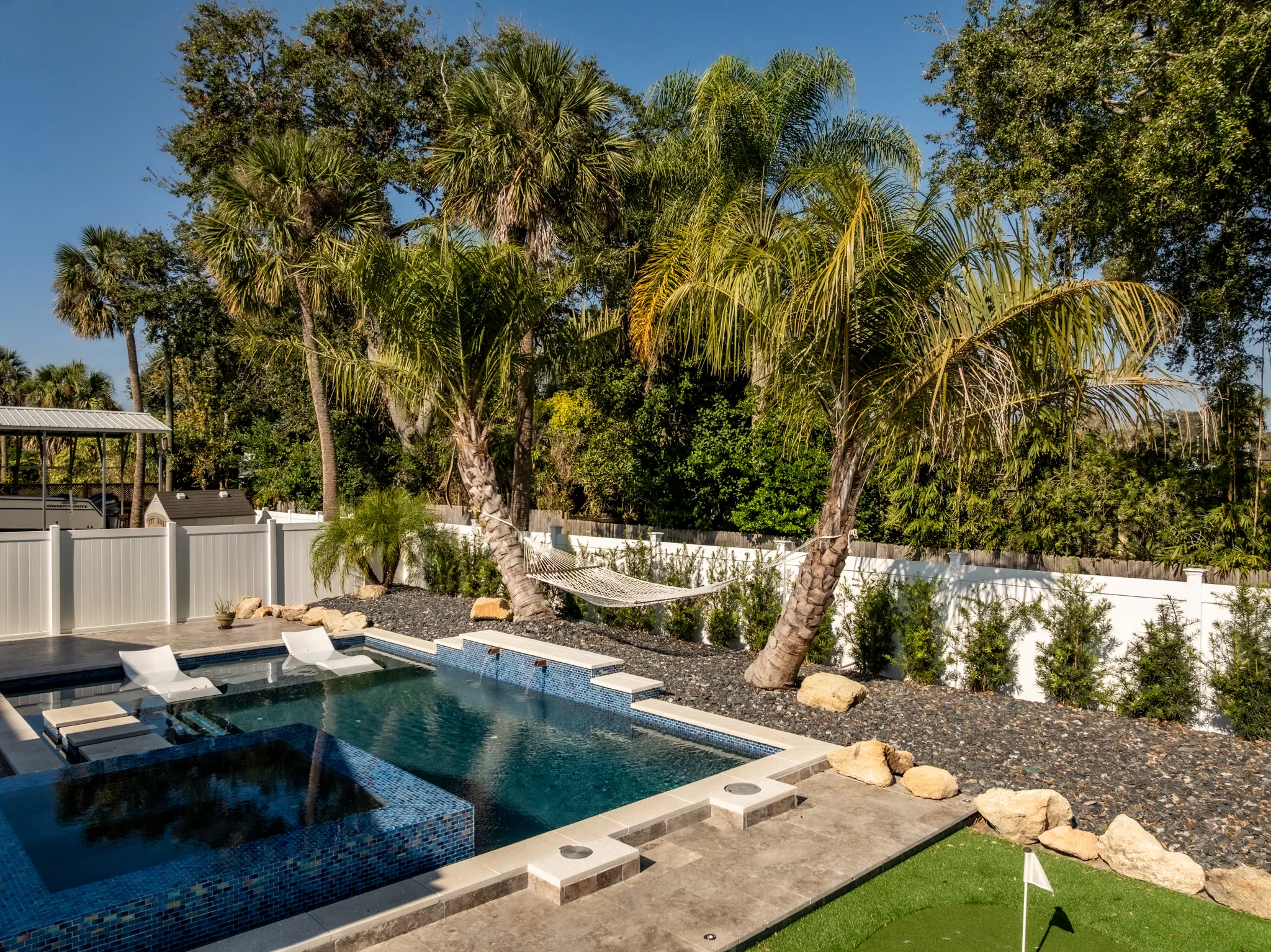 Coastal Walkway Design Custom walkway design in Jacksonville Beach with pavers, mulch, and tropical foliage