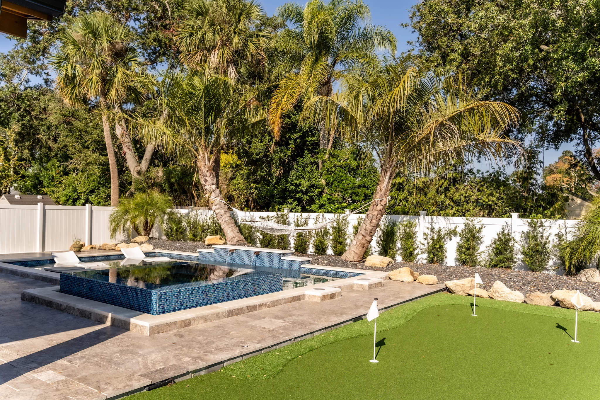 Backyard Putting Green Backyard putting green design in Jacksonville Beach with premium rock ground cover