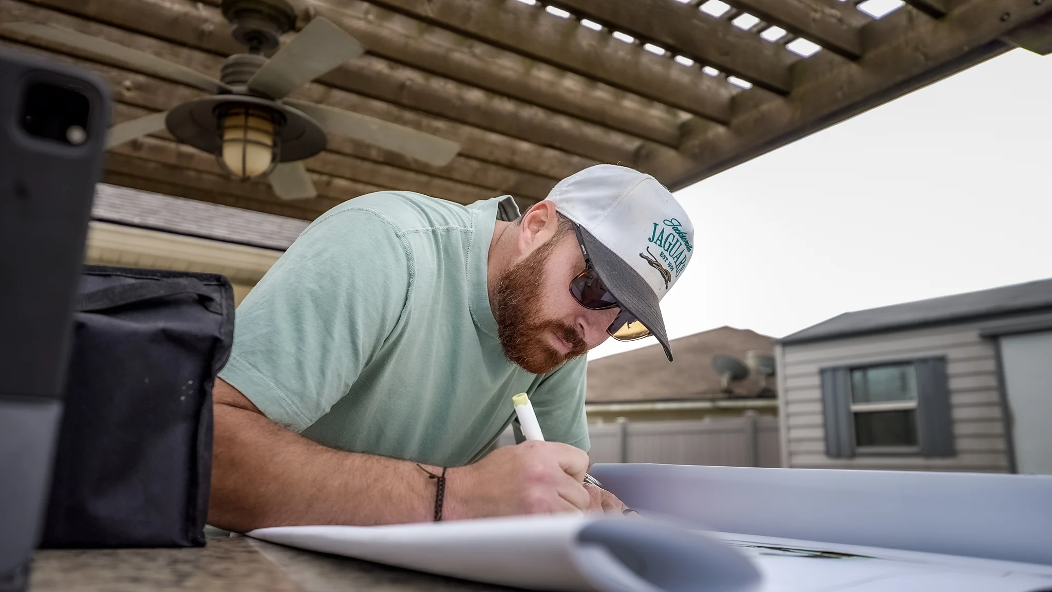 Chris working on a rendering Landscaping project planned with landscape design software for a high-end outdoor living transformation