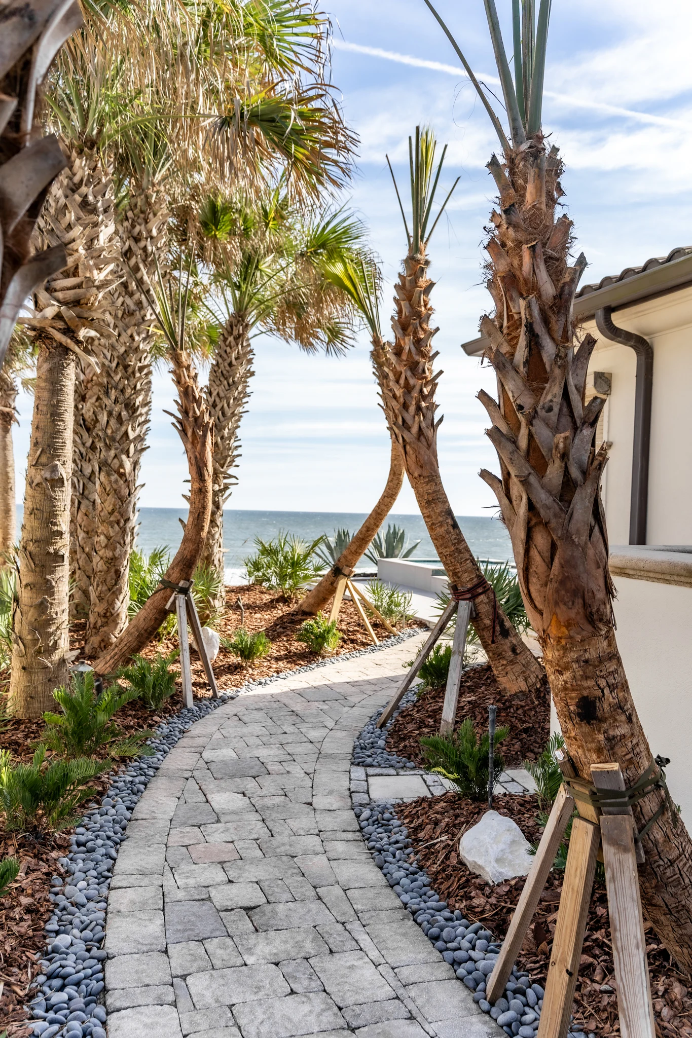 Elegant Paver Walkway Custom paver walkway on Ponte Vedra Blvd with stone edging and coastal plantings
