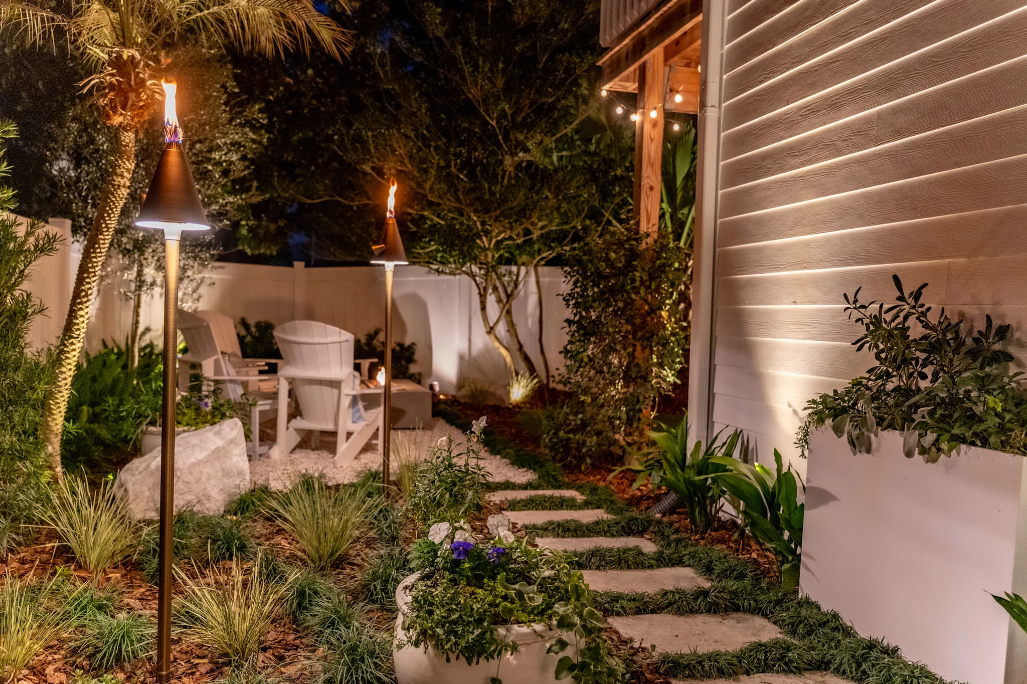 Atlantic Beach Oasis Luxury landscape design in Atlantic Beach with coastal plants, palms, and outdoor living space
