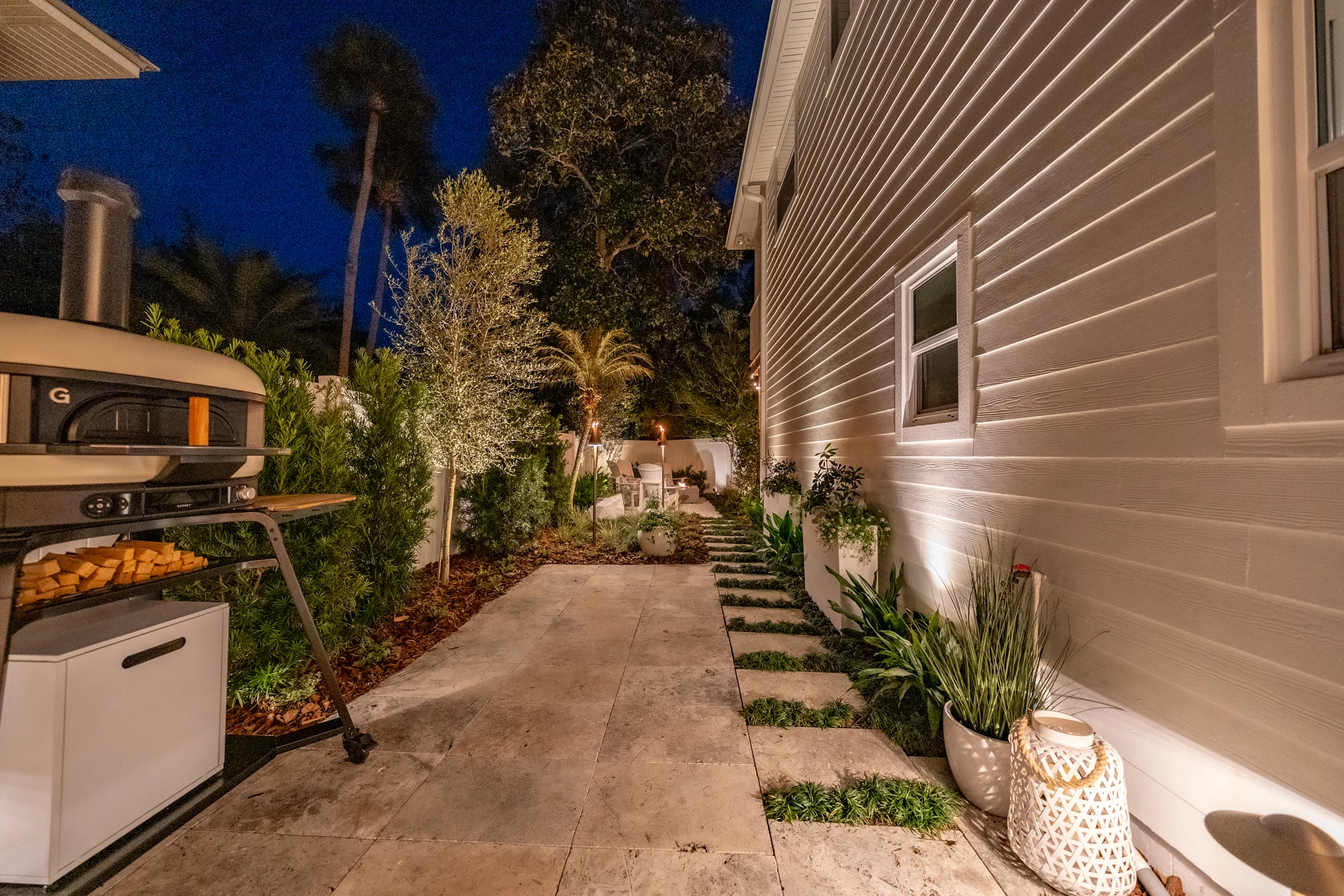 Outdoor Dining Patio Outdoor dining patio in Atlantic Beach with paver installation and tropical landscape design
