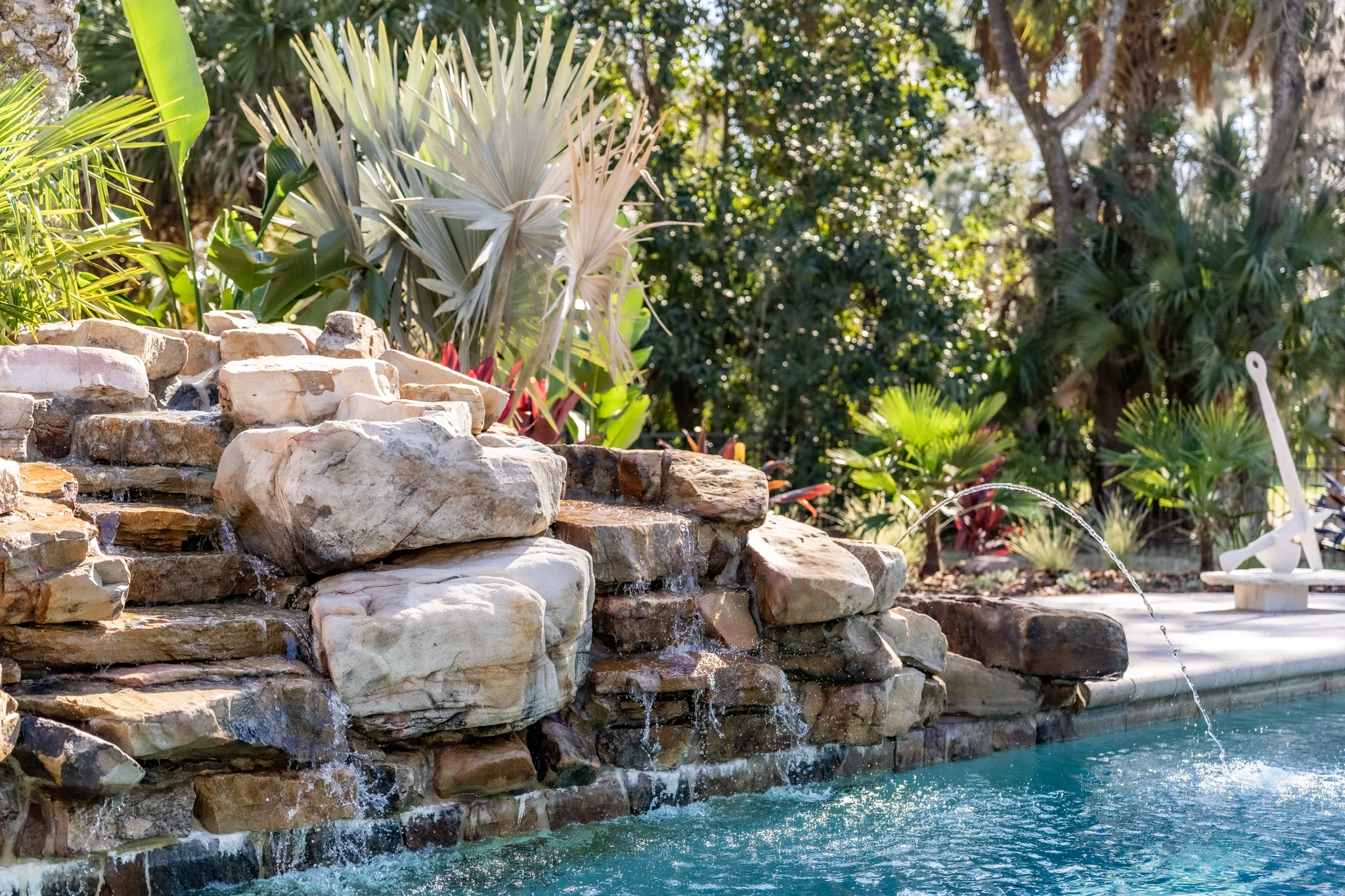 Luxury garden walkway with flagstone Luxury garden walkway with flagstone, tropical plants, and palms for a Ponte Vedra home