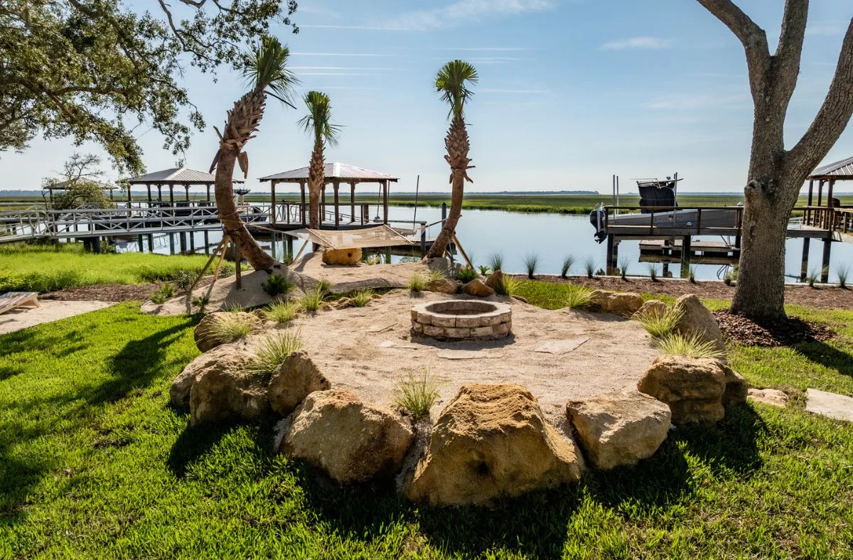 Fire Features 4 Natural stone fire pit with coastal landscaping for a luxury Fernandina Beach home