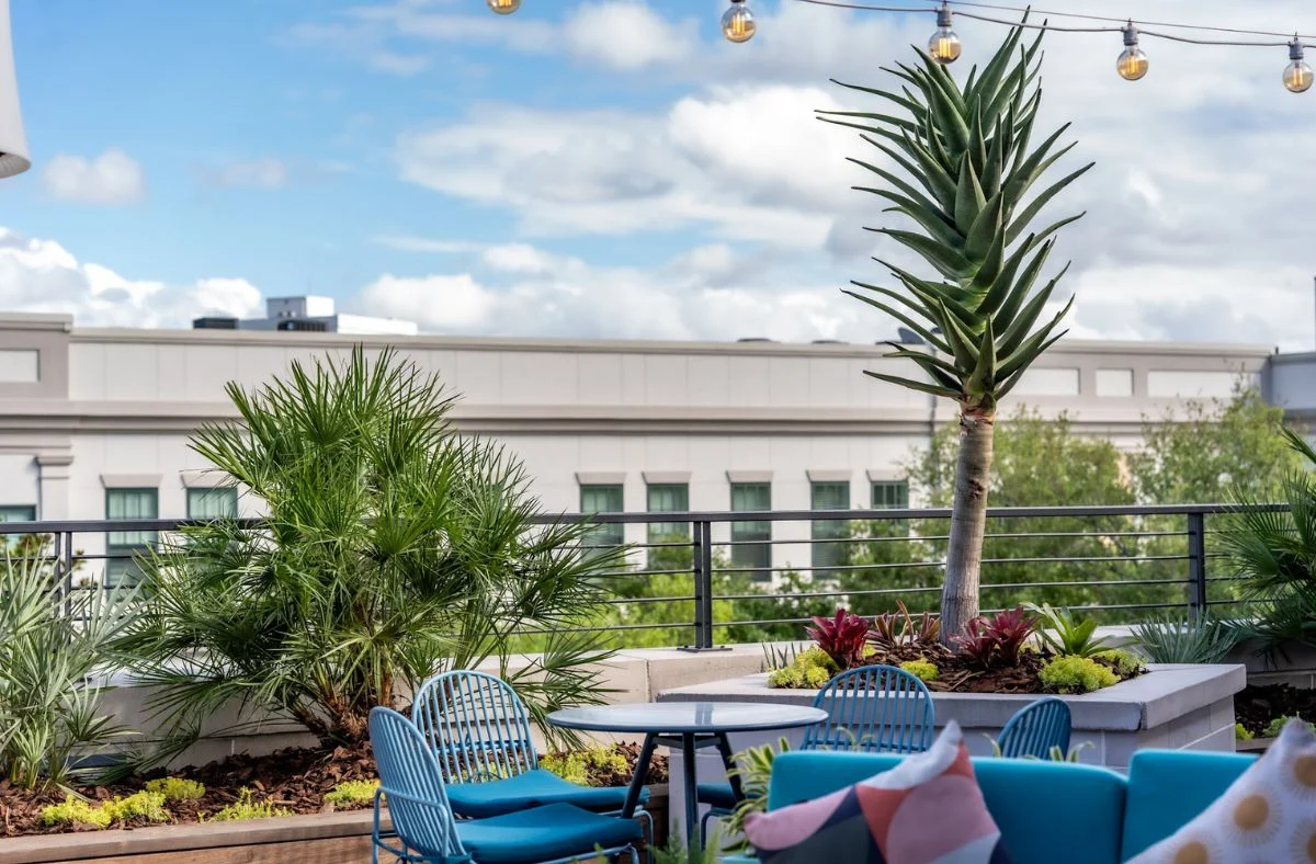 Top 10 Landscape Designer crafting a seating section of a patio