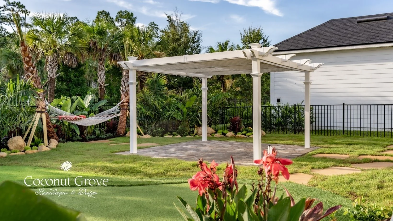 Holistic Outdoor Wellness Features Outdoor living as the go-to retreat, transformed by Coconut Grove with sauna, tropical privacy palms, and flagstone pathway in Nocatee